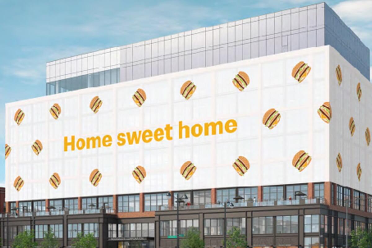 Large building with illustrations of hamburgers and "Home sweet home" written on it